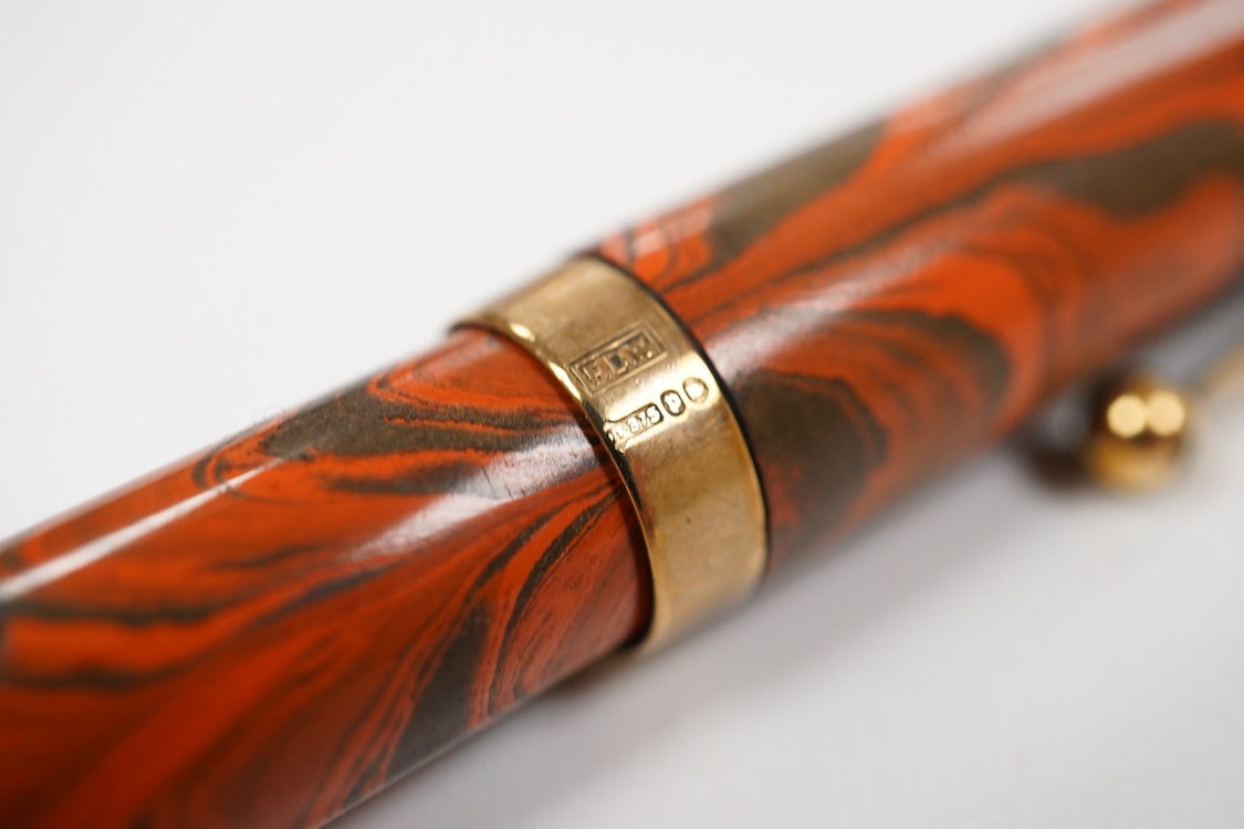A Waterman Red Ripple No. 5 lever filler with green cap band and fitted with No. 5 Waterman nib